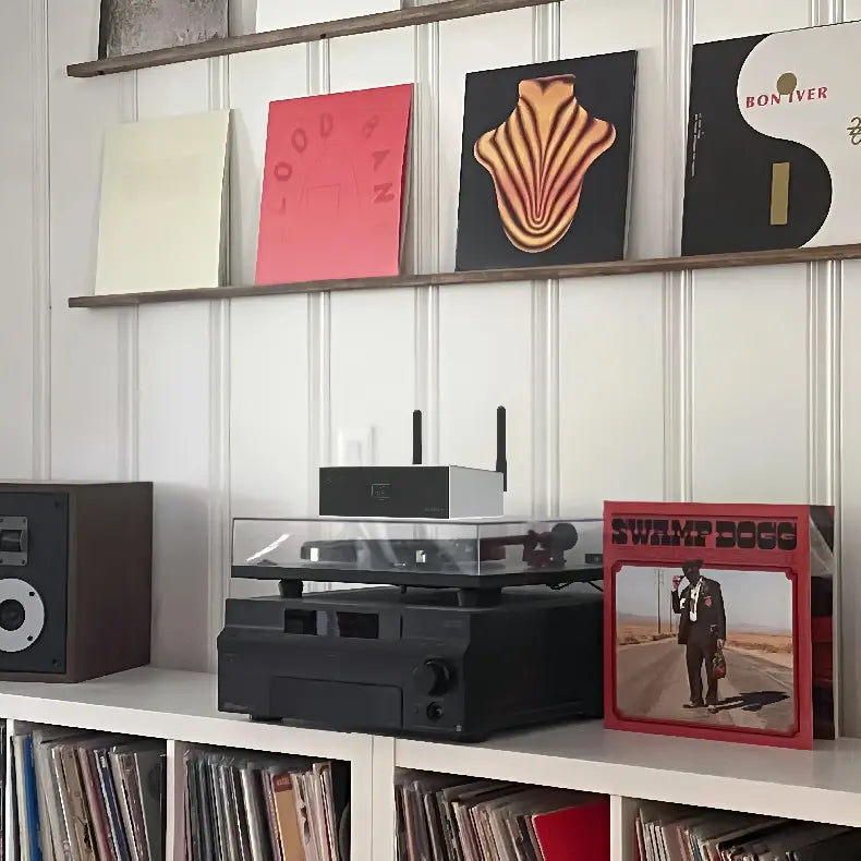 Arylic wireless amplifier with turntable and speakers, vinyl record home music setup.
