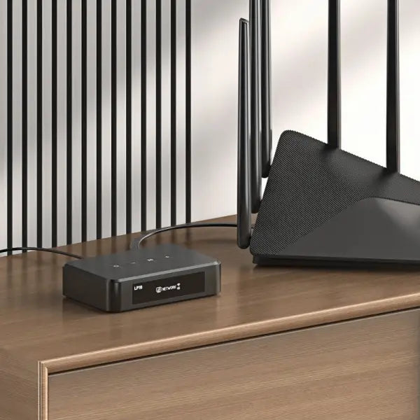 Arylic LP10 wireless audio streaming device placed next to a Wi-Fi router, showing network connectivity for music streaming