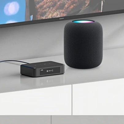 Arylic LP10 audio streamer connected with Apple HomePod smart speaker in a home entertainment setup
