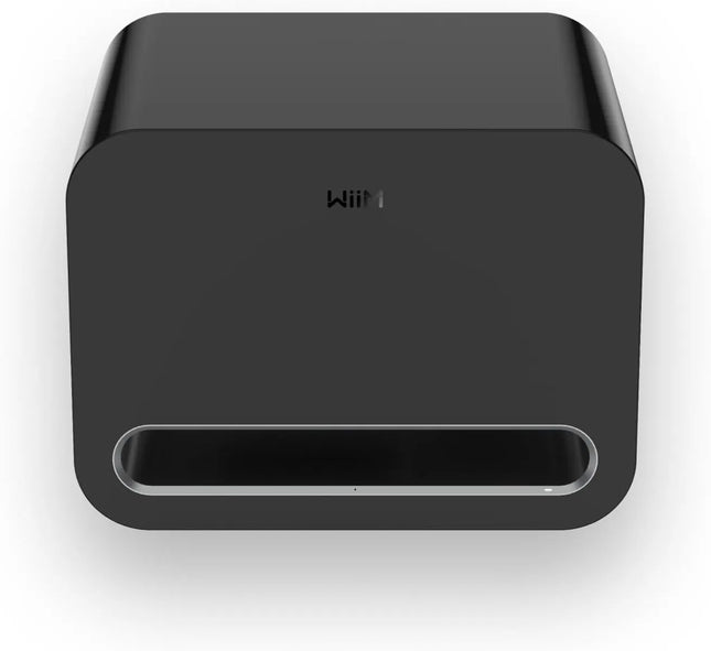 WiiM Sub Pro Wireless Subwoofer in Black/White sitting on a living room floor.